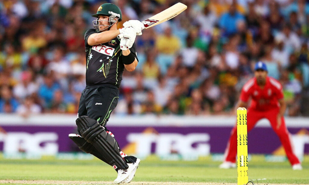 Aaron Finch in KFC cricket uniform striking a dynamic pose during an intense match wallpaper