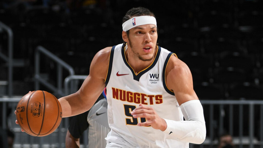 Aaron Gordon dribbling basketball in Denver Nuggets uniform showing focus and athleticism Wallpaper