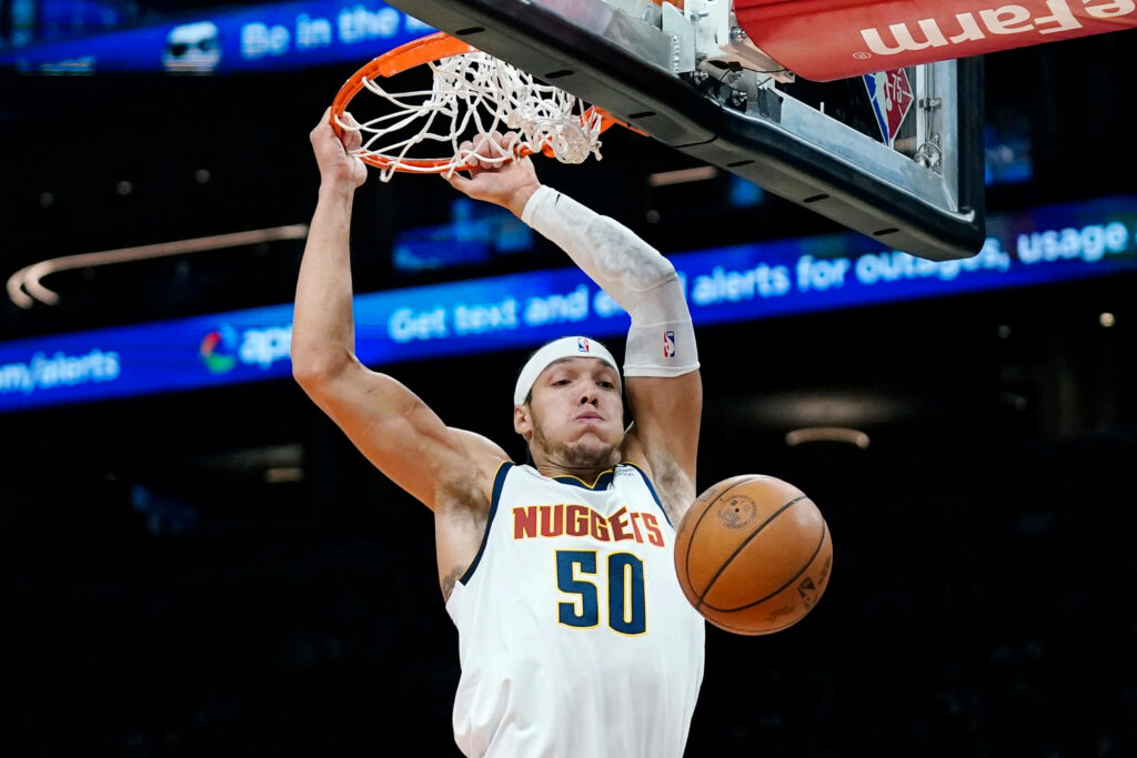 Aaron Gordon mid-air slam dunk in Denver Nuggets jersey basketball wallpaper background
