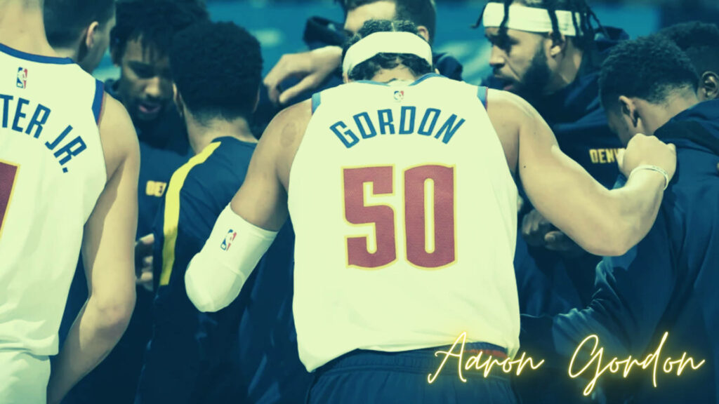 Aaron Gordon in jersey 50 with teammates in pregame huddle showing basketball team unity Wallpaper