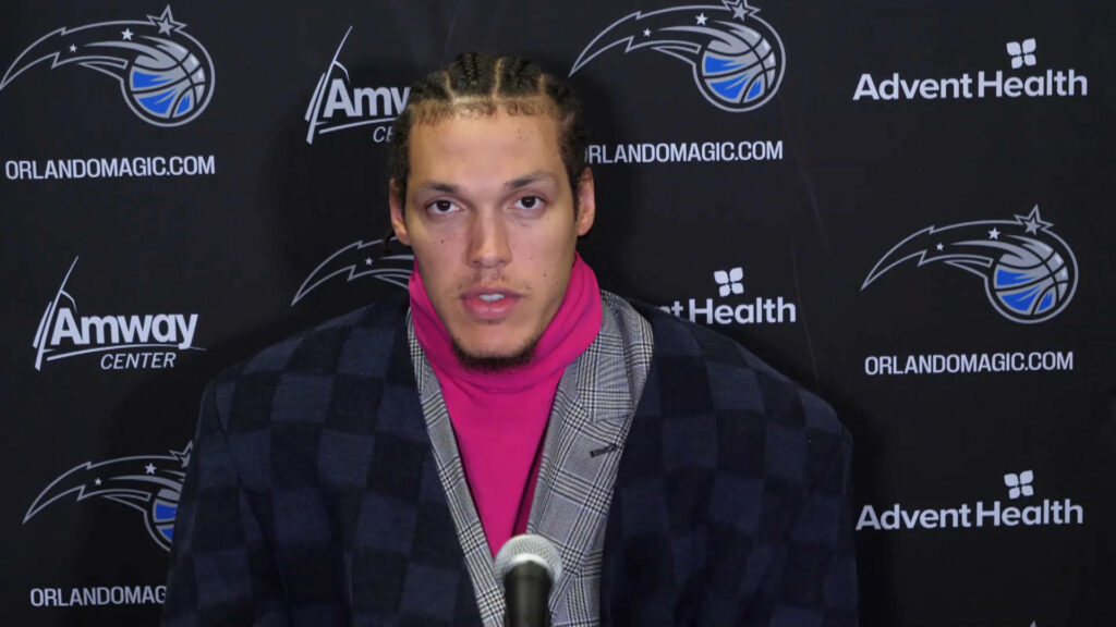 Aaron Gordon Orlando Magic press conference wearing checkered coat and pink turtleneck Wallpaper