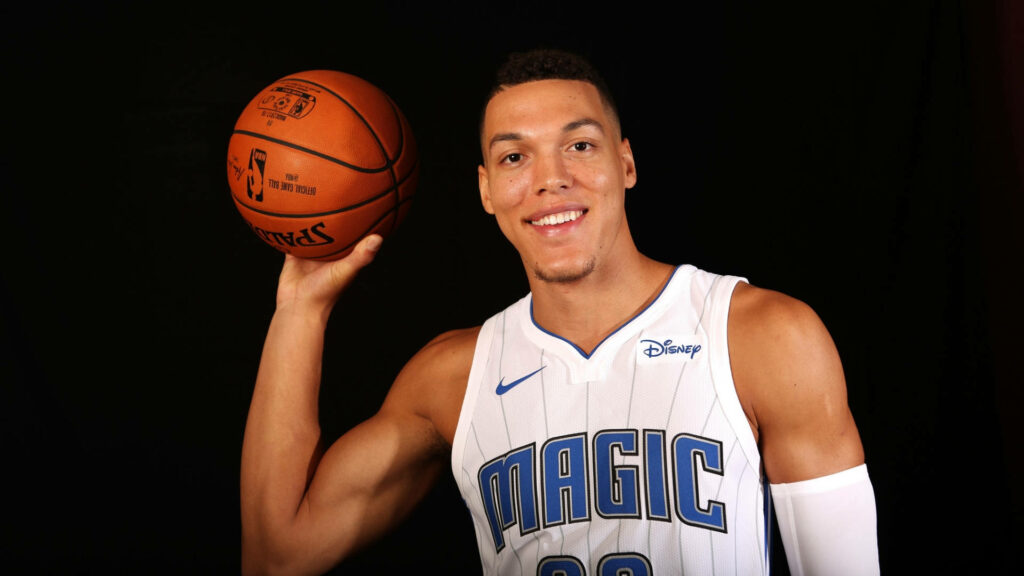 NBA star Aaron Gordon in Orlando Magic jersey holding basketball ready for game action wallpaper