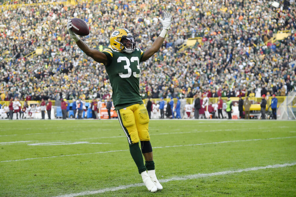 Aaron Jones celebrates in end zone showing energy and determination football dynamic wallpaper