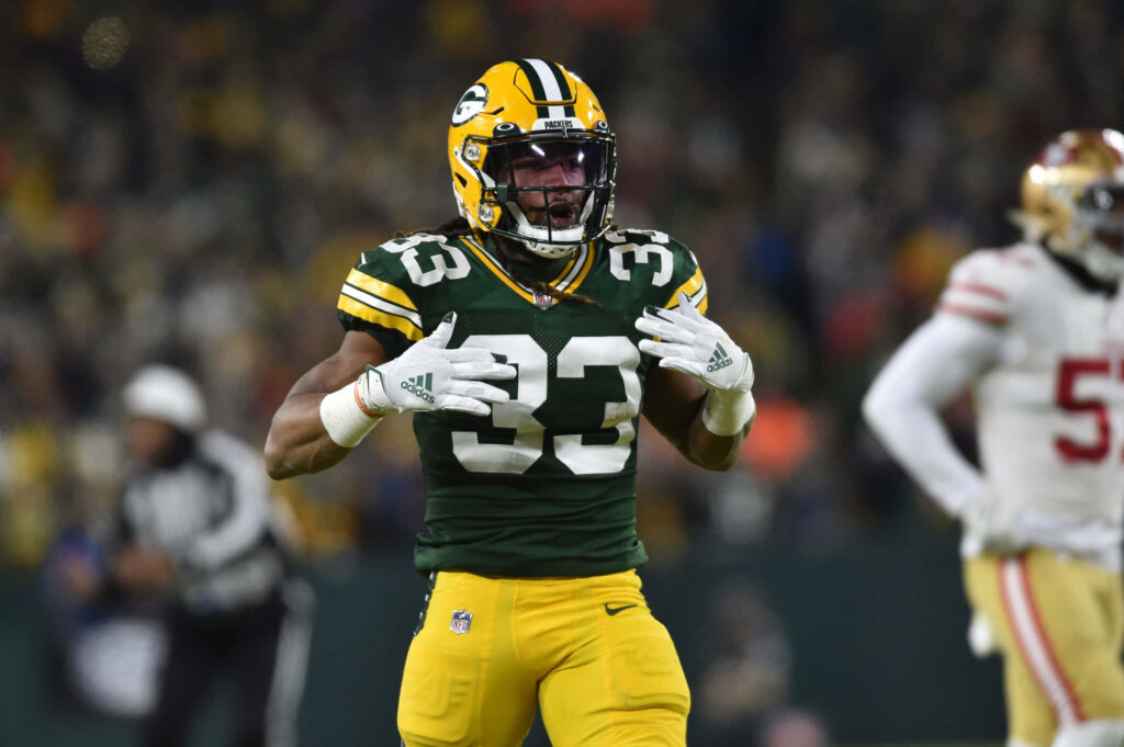 Aaron Jones Green Bay Packers running back focused intense during NFL game on field wallpaper