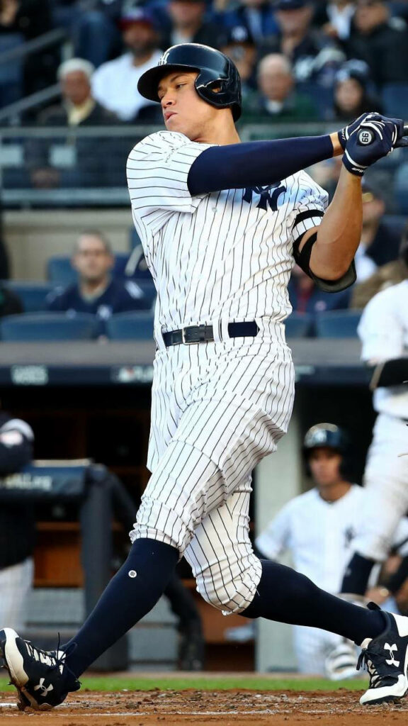 Aaron Judge mid-swing powerful batting stance New York Yankees uniform baseball game wallpaper