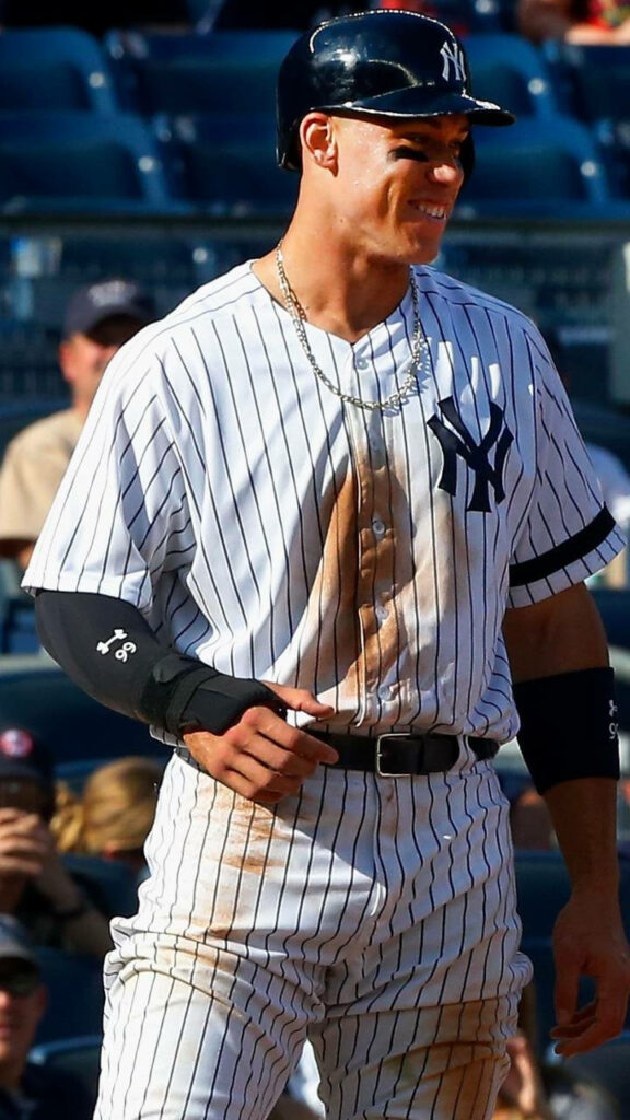 Aaron Judge in New York Yankees uniform with stained jersey showing baseball grit on field wallpaper