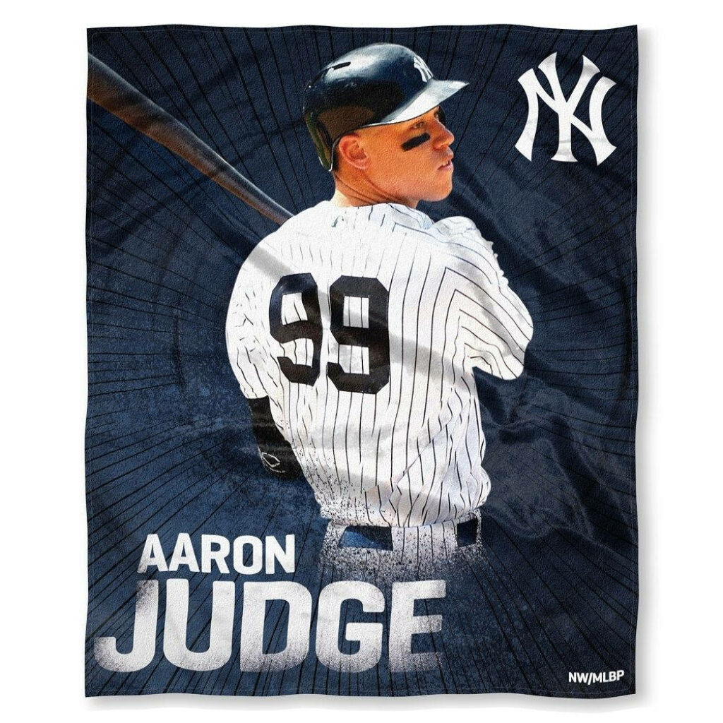 Aaron Judge in white Yankees shirt number 99 batting pose on dark blue background with logo Wallpaper