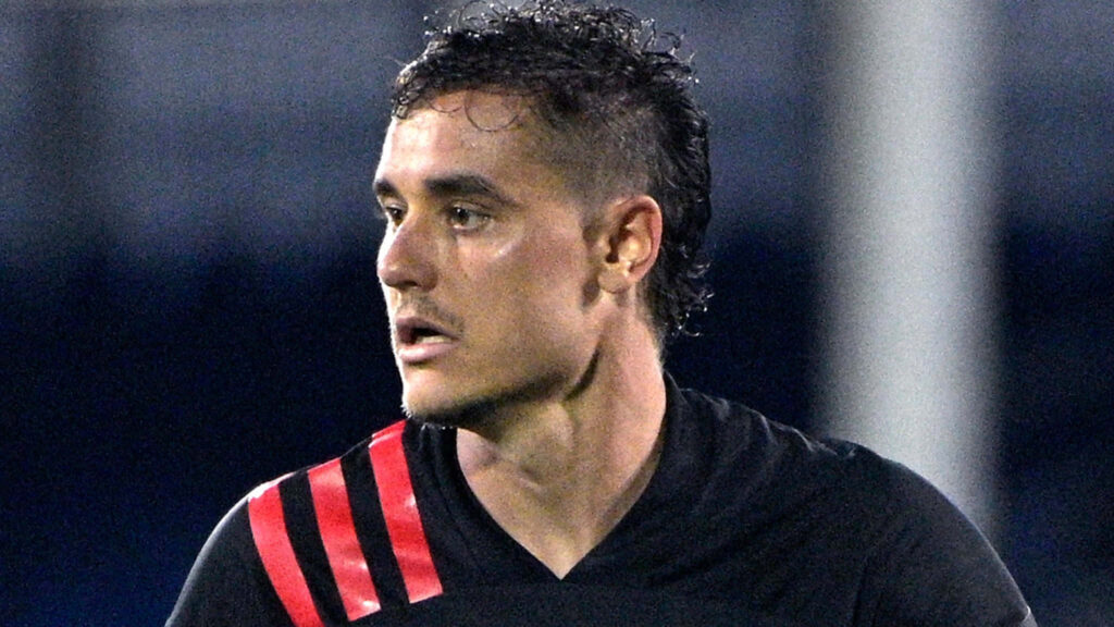 Close-up of American soccer player Aaron Long focused during intense match wallpaper background