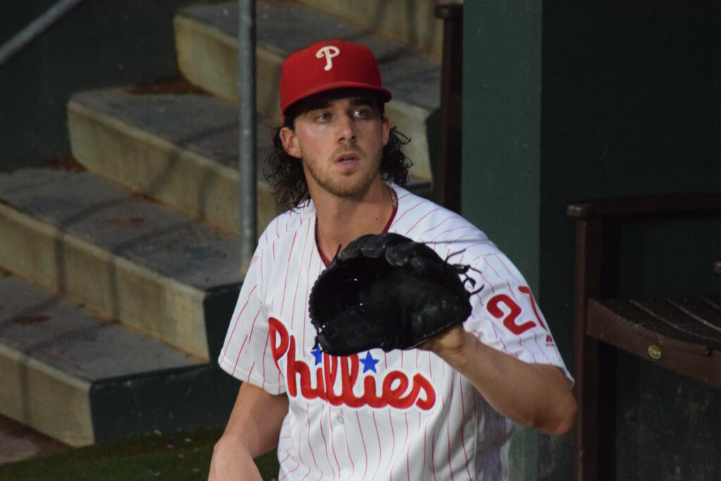 Aaron Nola Philadelphia Phillies pitcher holding mitt focused in game action wallpaper background
