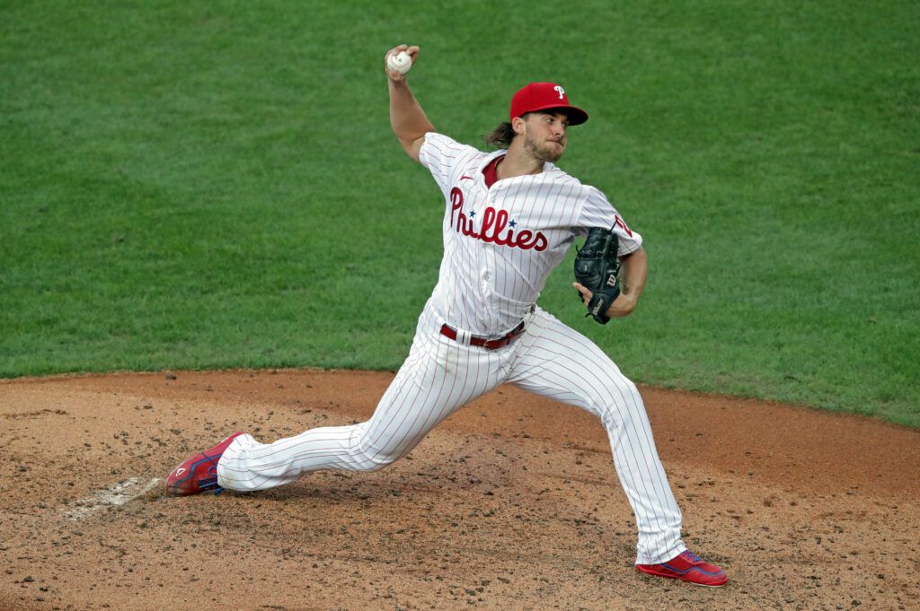 Aaron Nola Philadelphia Phillies pitching mid throw powerful form baseball wallpaper background