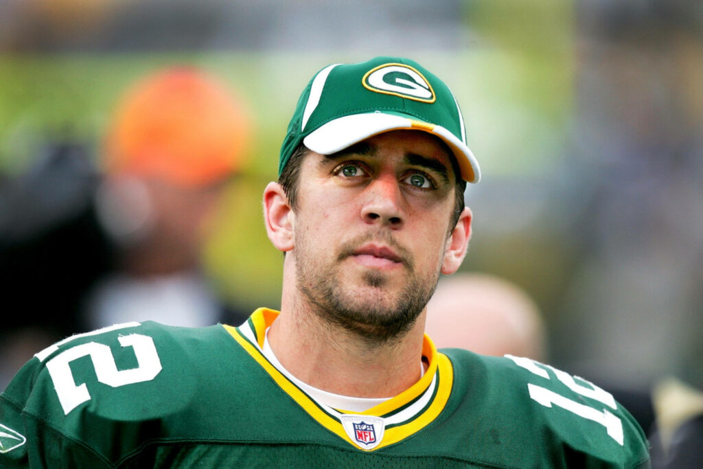 Close-up of Aaron Rodgers Green Bay Packers quarterback focused in green jersey and cap wallpaper
