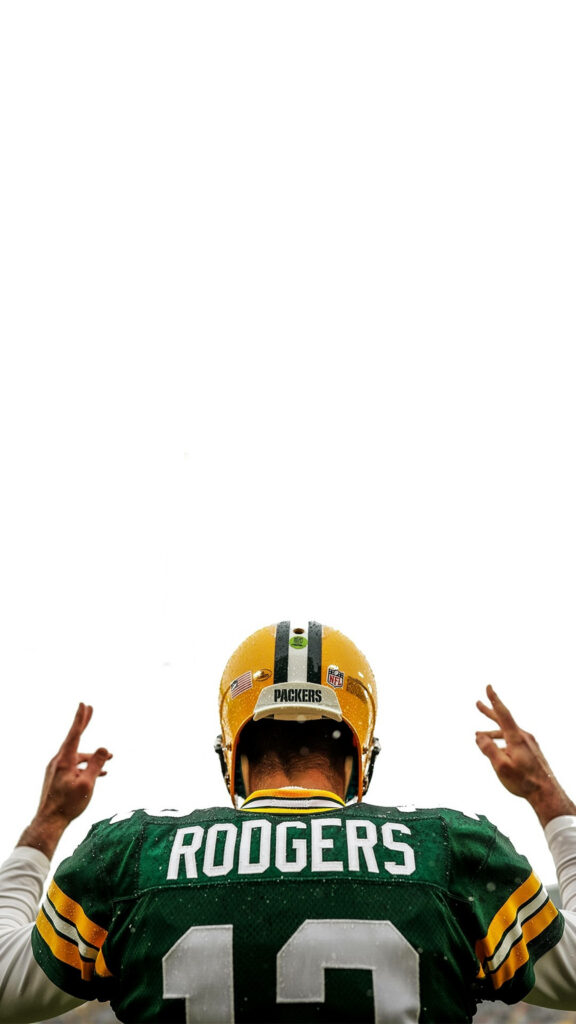 Aaron Rodgers back view in Green Bay Packers number 12 jersey and helmet on football field wallpaper