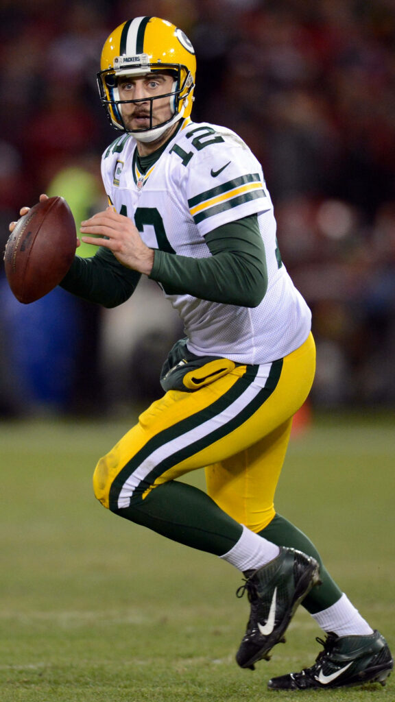 Aaron Rodgers Green Bay Packers football player preparing to throw pass on field wallpaper