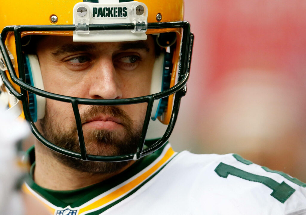 Aaron Rodgers Packers close-up intense focus in Green Bay helmet and uniform game-ready wallpaper