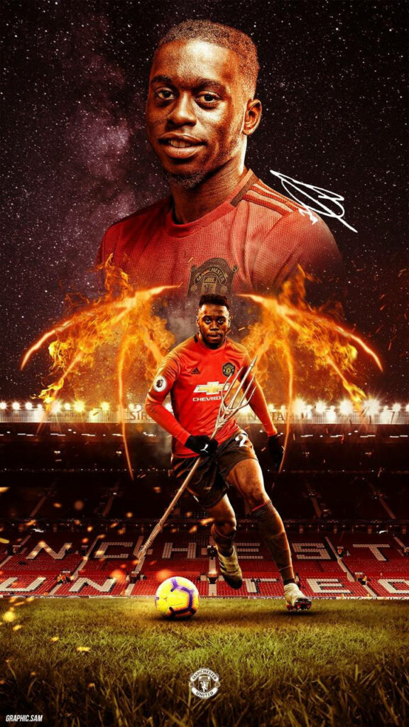 Aaron Wan-Bissaka on football pitch with fiery batwings dynamic wallpaper showing fierce determination