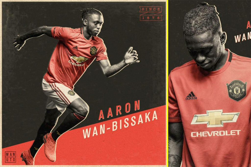 Aaron Wan-Bissaka in action Manchester United red kit dynamic intense football wallpaper background