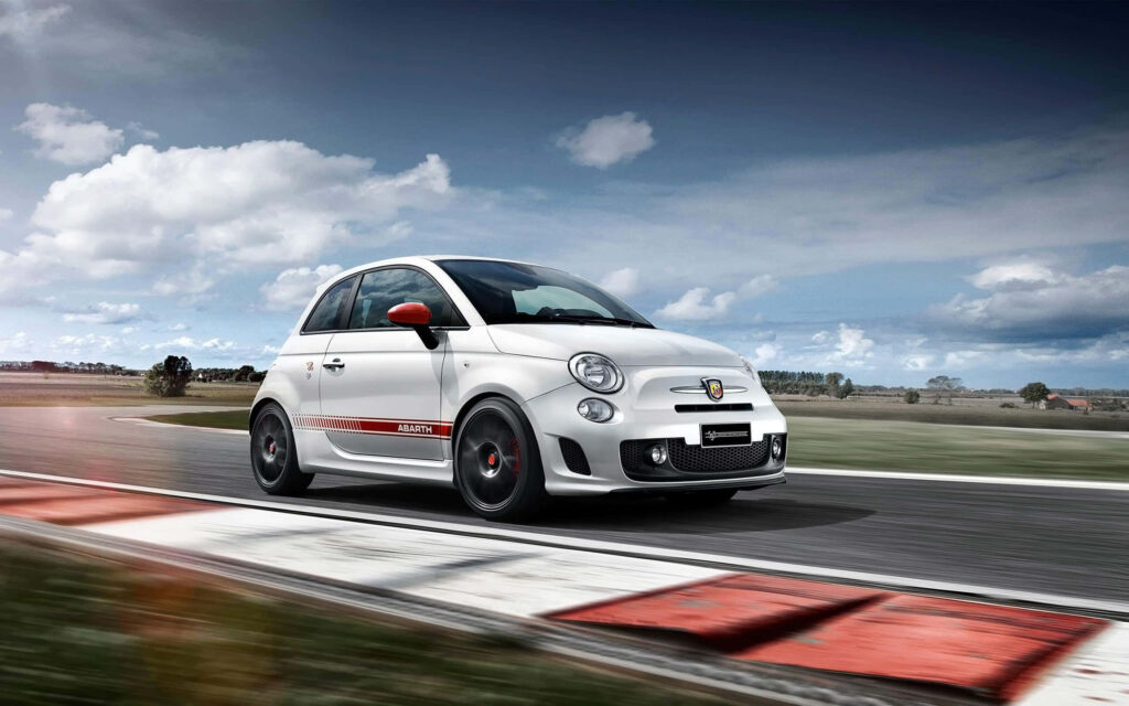 Abarth 500 speeding on open road sporty design dynamic presence partly cloudy sky wallpaper