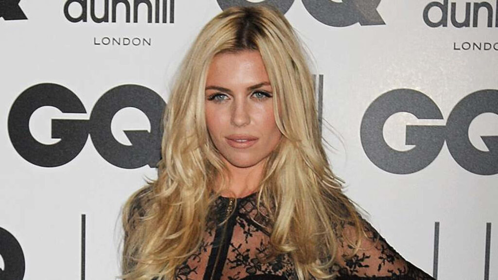 Abbey Clancy confidently poses on red carpet at GQ event showcasing chic fashion style background Wallpaper