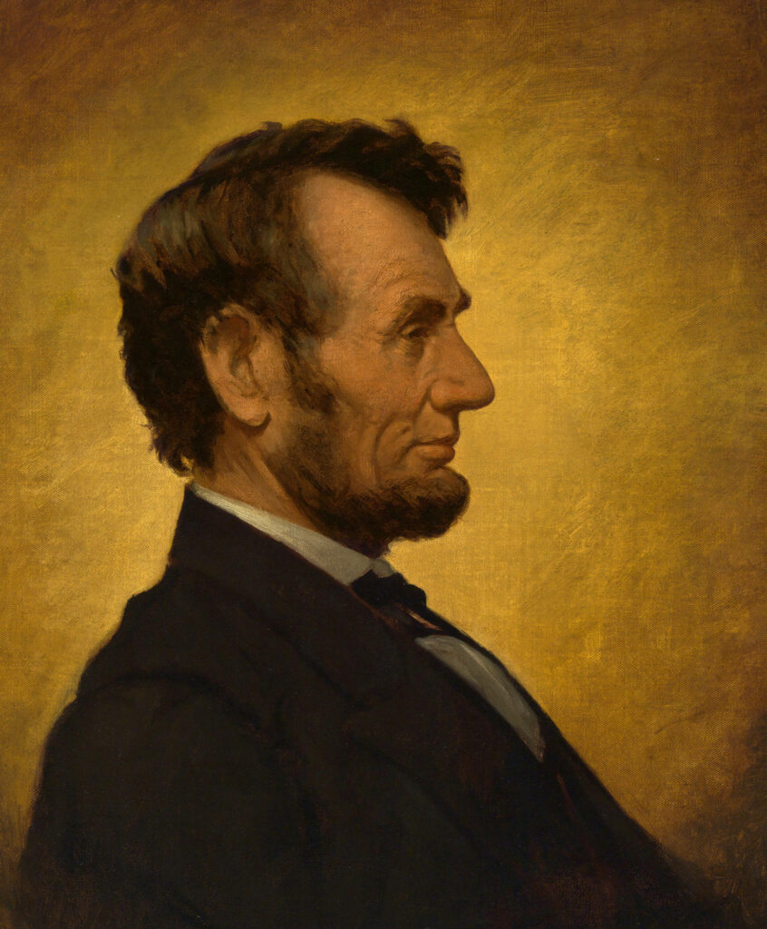 Side view portrait of Abraham Lincoln on warm golden background wallpaper background