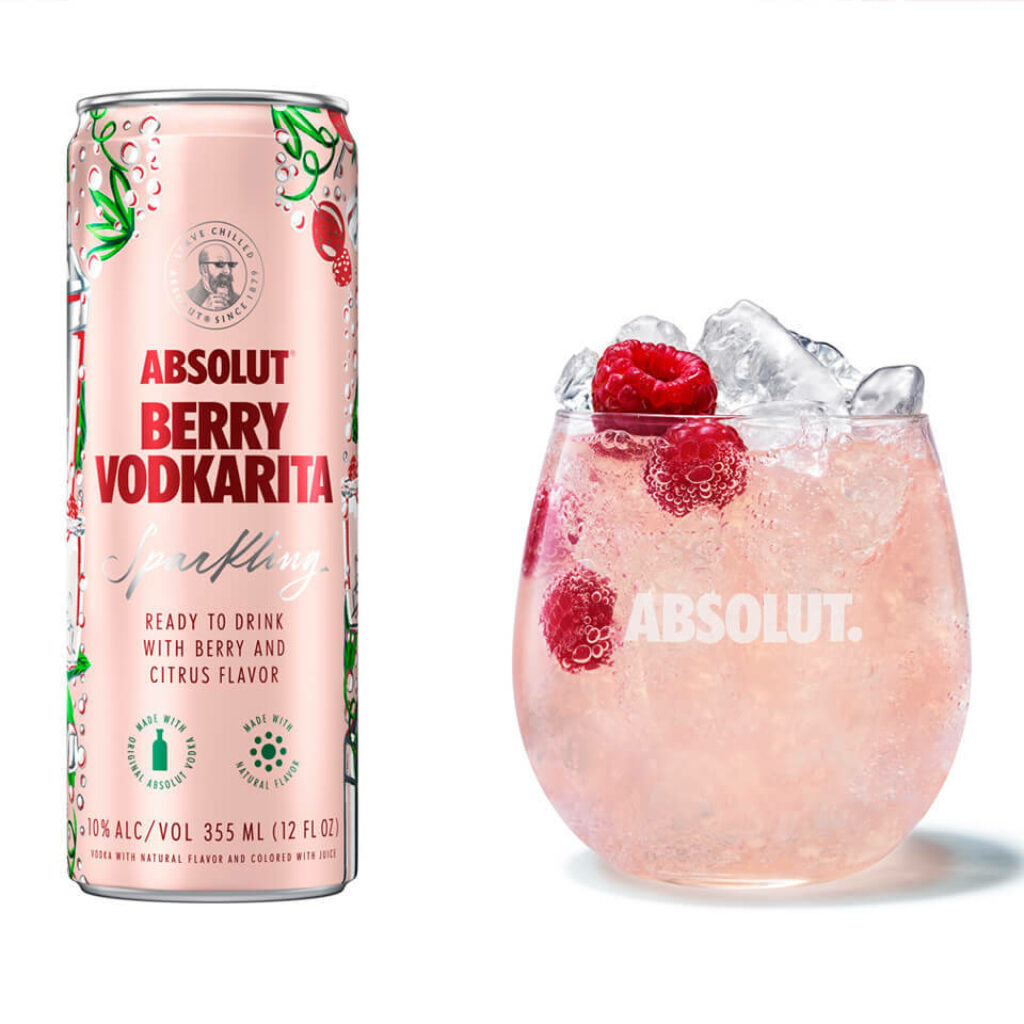 Absolut Berry Vodkarita can beside glass with ice fresh raspberries vibrant berry citrus cocktail Wallpaper