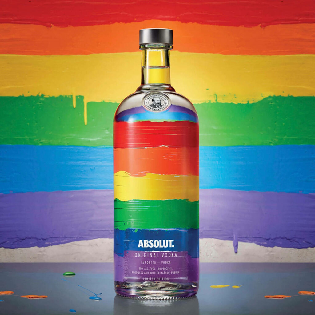 Absolut Vodka bottle with vibrant rainbow stripes on matching rainbow background celebrating pride Wallpaper