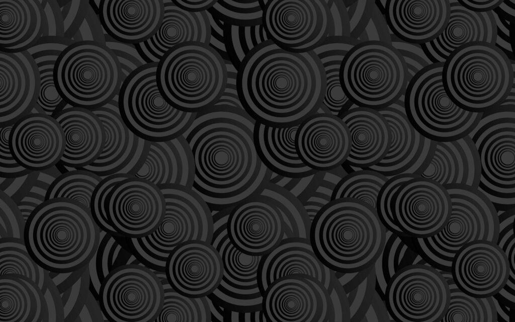 Dancing Circles: Mesmerizing 3D Textures on Ebony Canvas Wallpaper