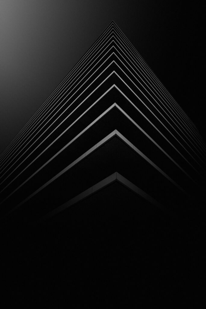 Abstract Architectural Wallpaper: Sharp Structure on Sleek Black Background
