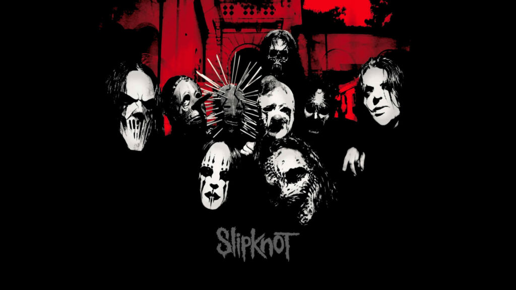 Intense Abstract Portrait: Slipknot's Haunting Face Mask Immersed in Vibrant Abstract Shapes Wallpaper