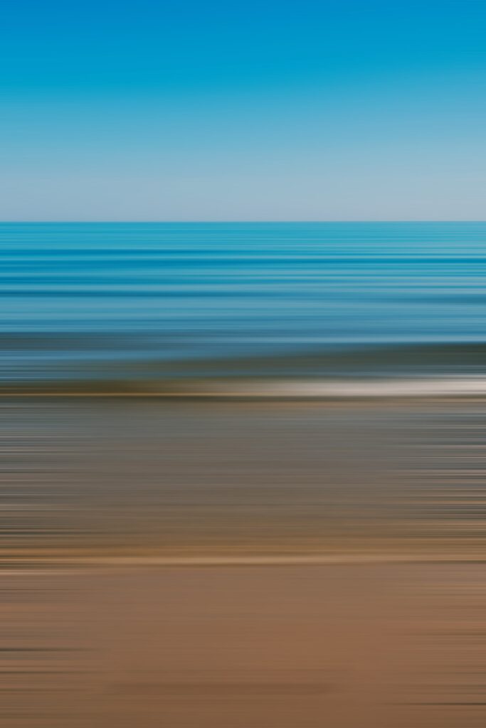 Abstract Beach Wallpaper: Blurred Stripes of Shore and Ocean