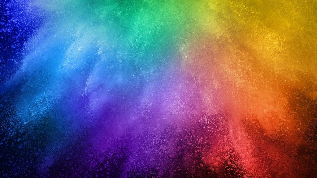 Vibrant abstract wallpaper with colorful powder burst on dark background for desktop display