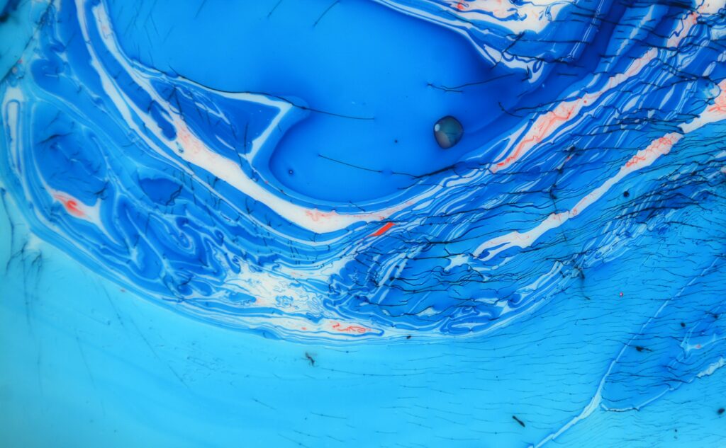 Abstract Blue Liquid Paint Wallpaper with Ocean Wave Patterns