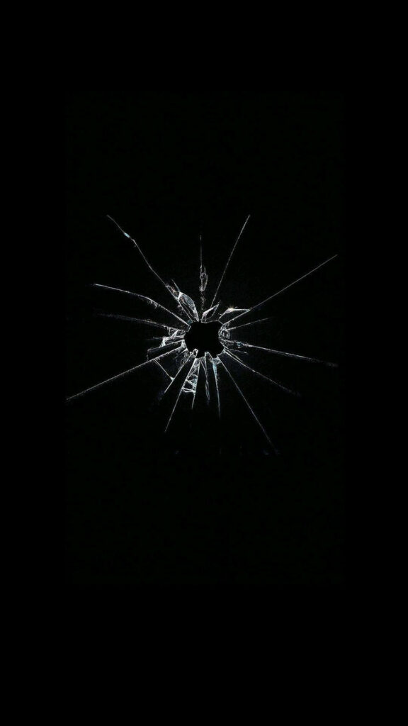 Abstract broken glass shards radiate from center on black background edgy modern wallpaper design