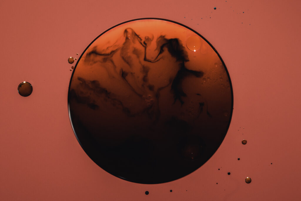 Abstract Red Wallpaper: Dark Swirling Bubble & Dynamic Droplets