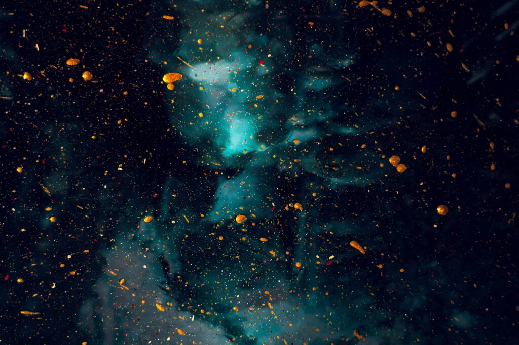 Abstract Cosmic Background Wallpaper: Dark Colors & Golden Splatter
