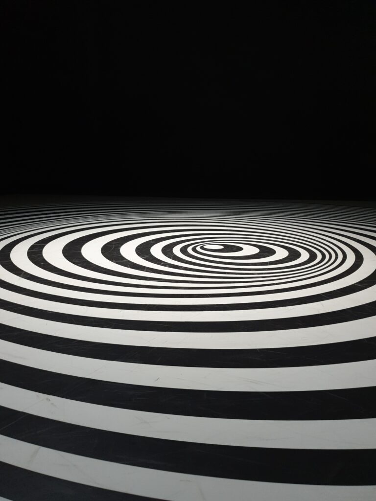 Abstract Black and White Wallpaper with Hypnotic Swirling Circles