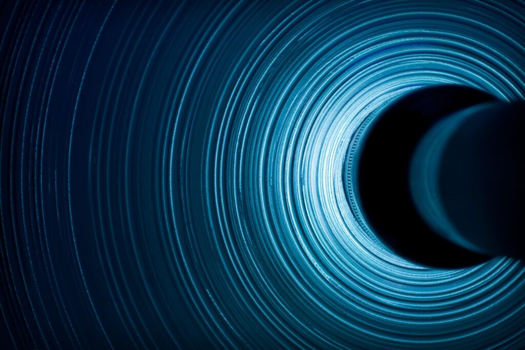 Abstract Dark Blue Spiral Wallpaper with Dynamic Lighting Effects