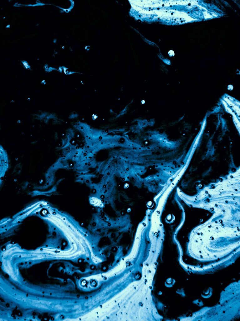 Abstract Deep Blue and Black Wallpaper with Fluid Motion Design