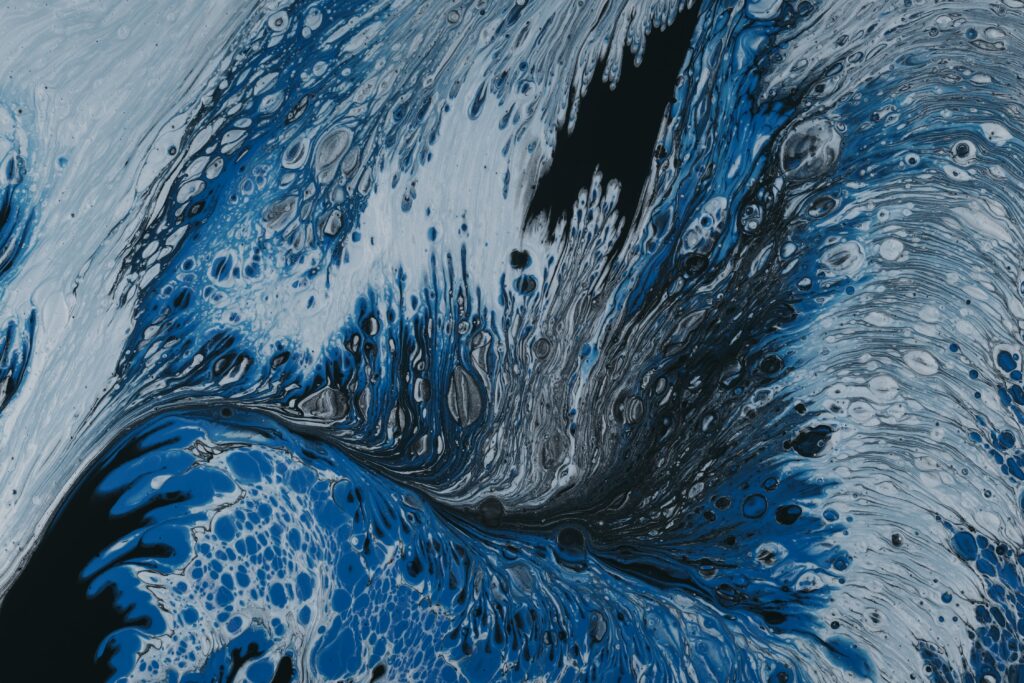 Intriguing Abstract Wallpaper: Liquid Paint Swirls in Blue, Black & White
