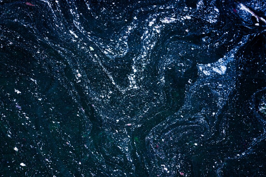 Abstract Liquid Paint Wallpaper: Dark Swirling Patterns Background