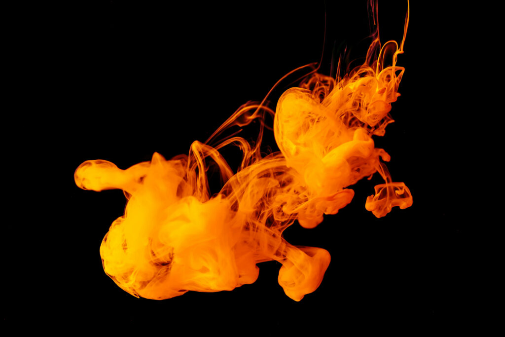 Captivating Abstract Orange Smoke Embraced by Photoshop's High Definition Black Background - A Striking Wallpaper Design