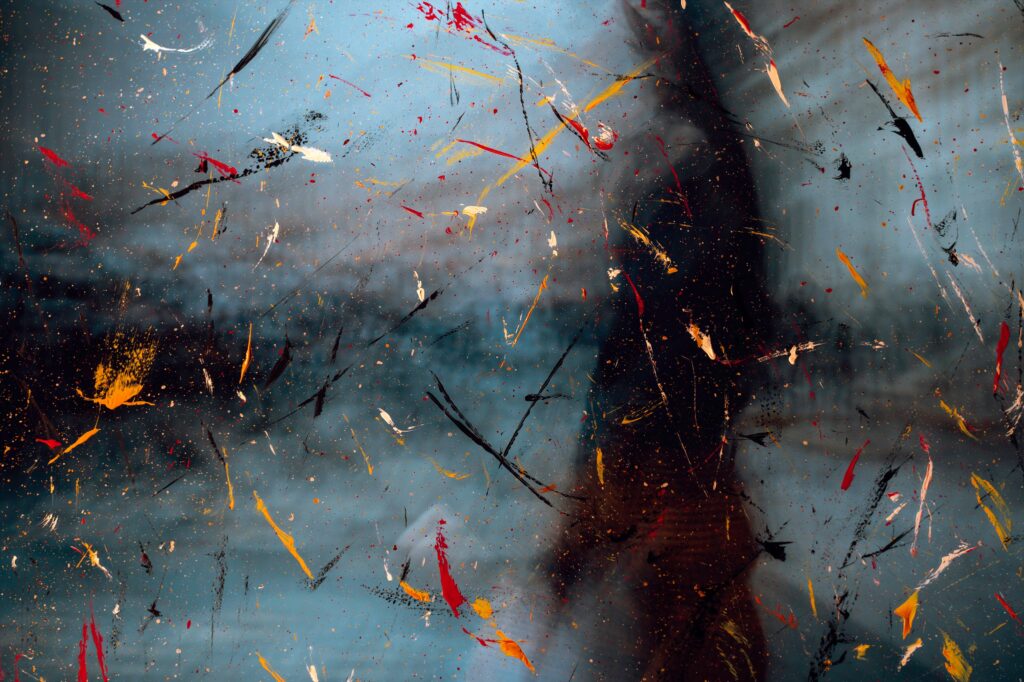 Dynamic Abstract Wallpaper: Paint Splatters on Glass Background