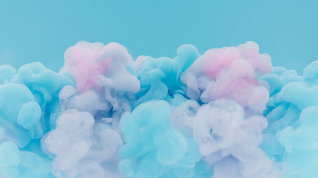 Abstract wallpaper with pastel pink and blue smoke clouds on light blue background for tranquility