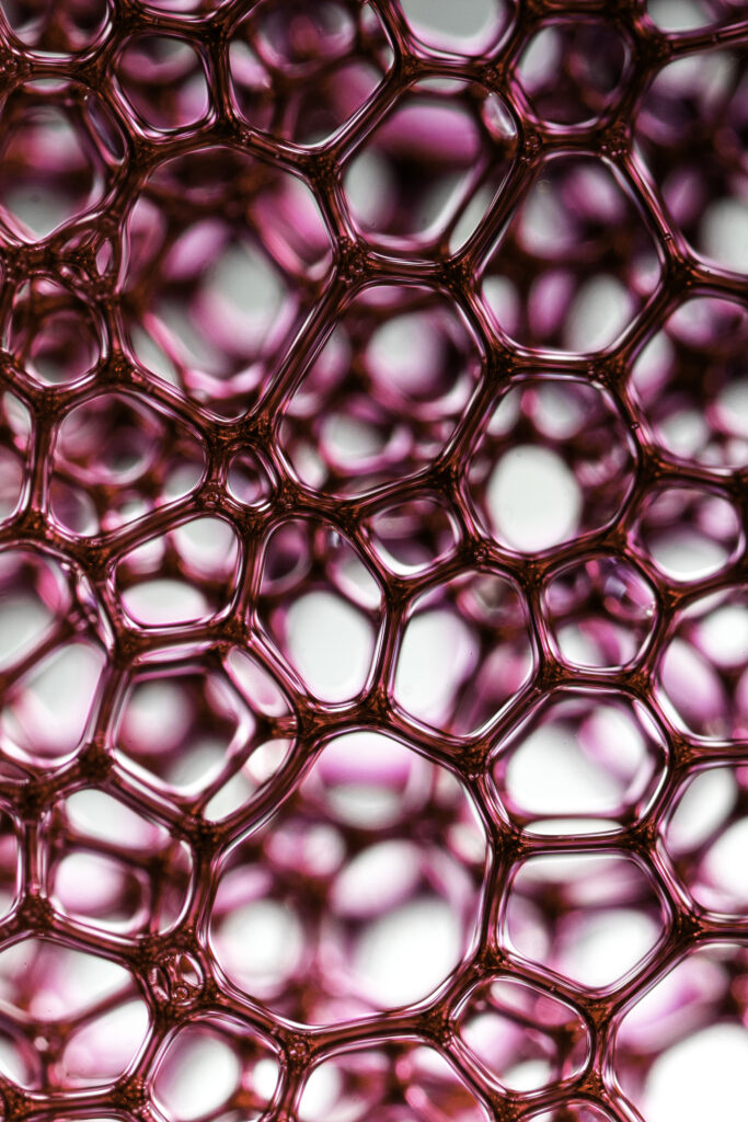 Abstract Pink Wallpaper: Glossy Cell-Like Patterns with Depth