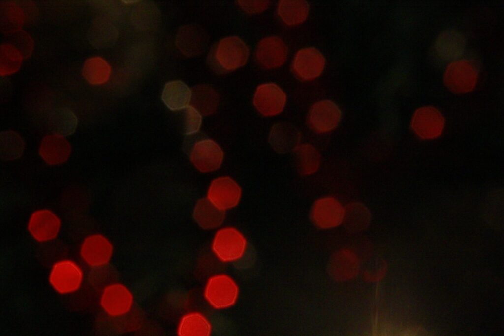 Abstract Red Bokeh Wallpaper on Dark Background - Captivating Design