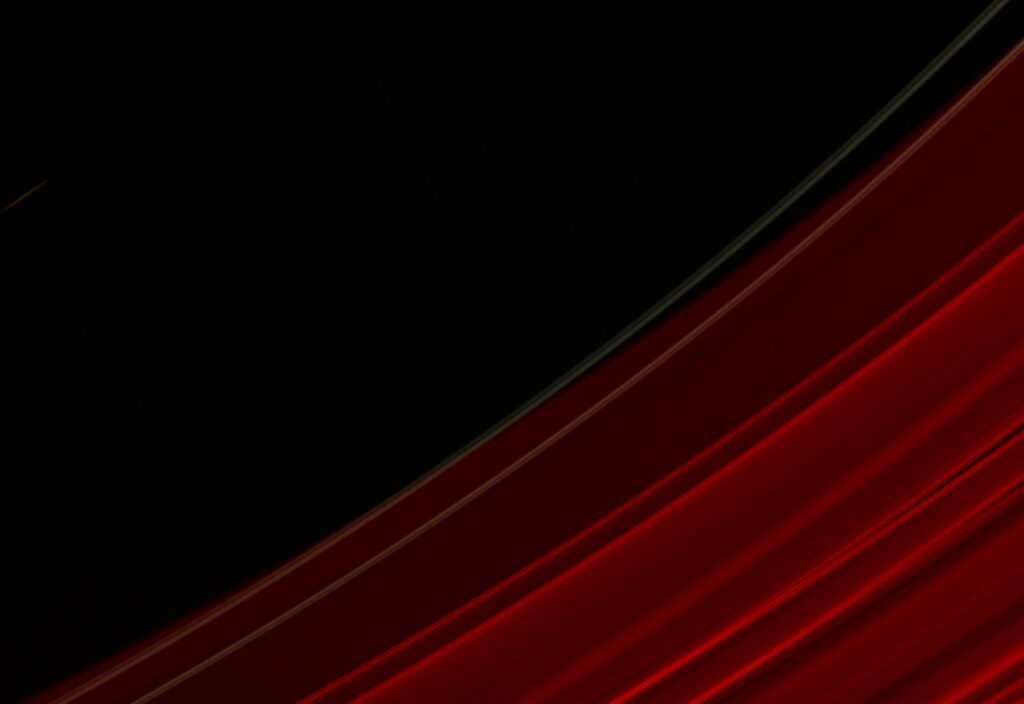 Dynamic Abstract Red Wallpaper on Deep Black Background