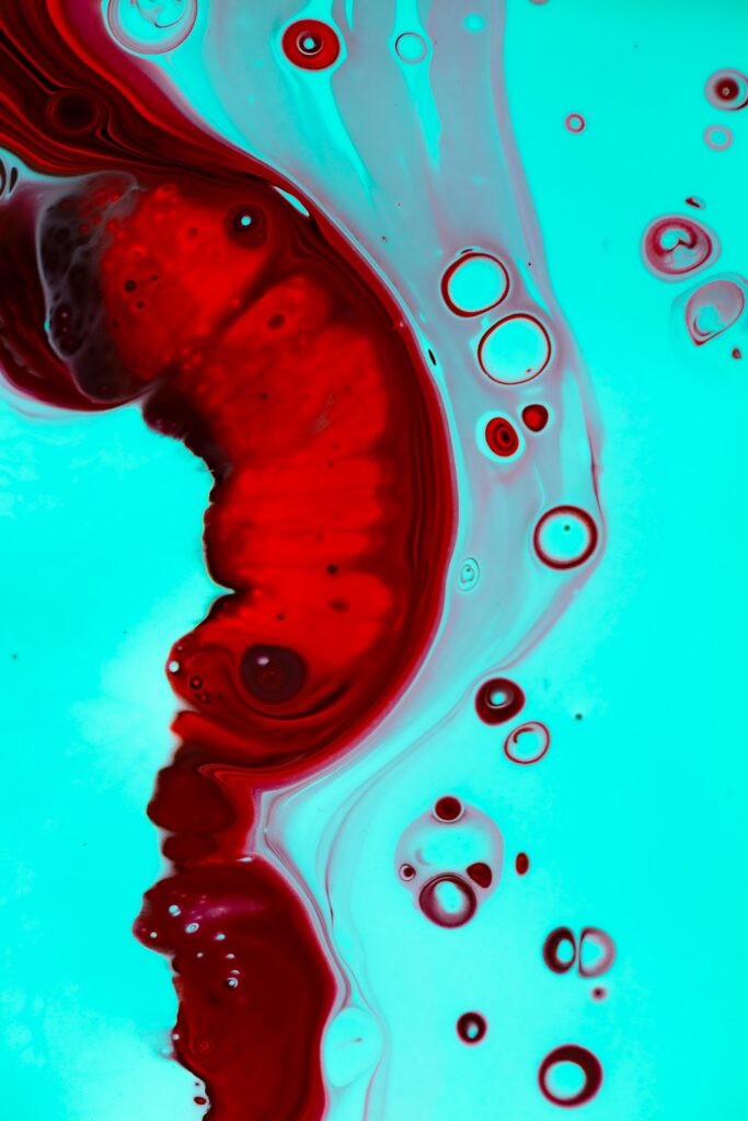 Vibrant Abstract Liquid Wallpaper in Red & Turquoise Background
