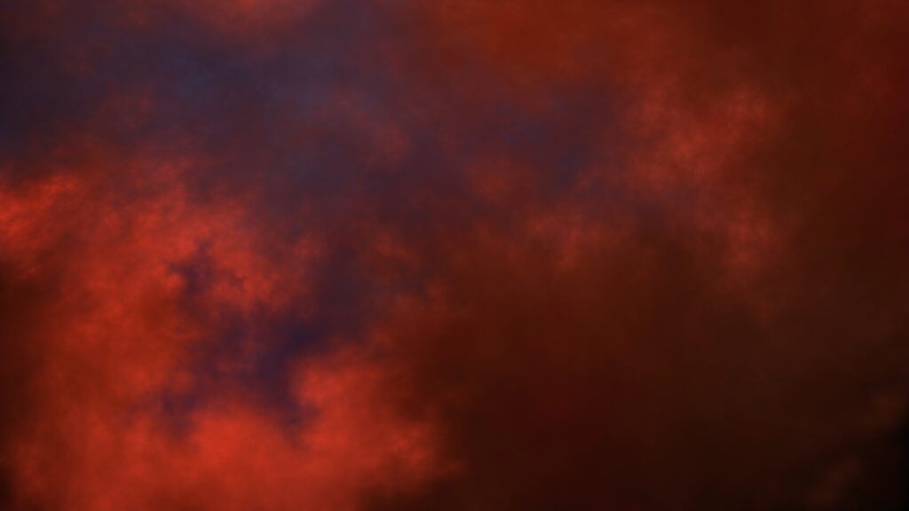 Abstract Swirling Clouds Wallpaper: Deep Orange & Blue Background