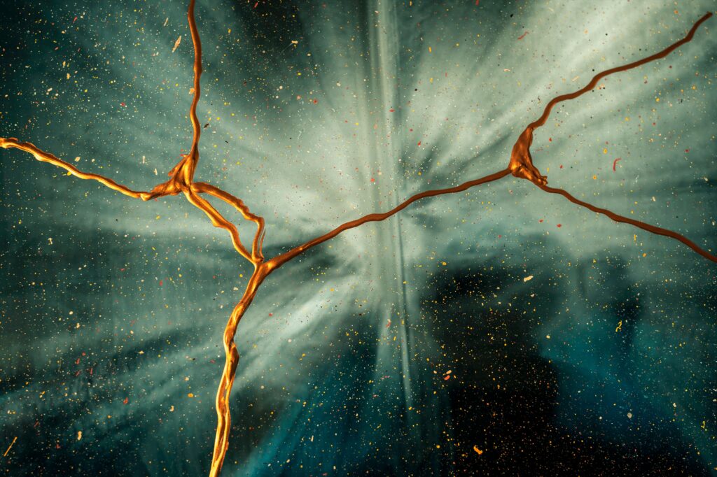 Abstract Wallpaper: Golden Paint Splash on Teal Background