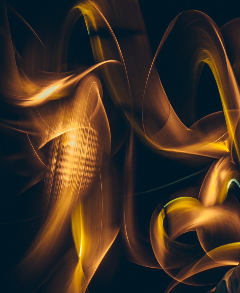 Glowing Orange and Yellow Abstract Light Trails Wallpaper Background