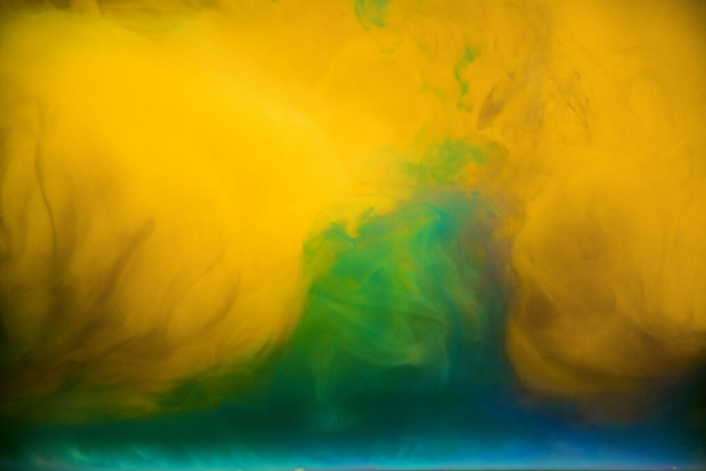Abstract Artistry: Green and Yellow Water-Color Paint Splatter Creates a Blurry and Artistic Wallpaper Background Photo
